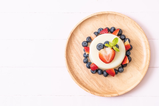 yogurt pudding with fresh strawberries and blueberries