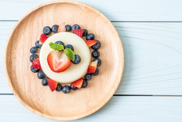 yogurt pudding with fresh strawberries and blueberries