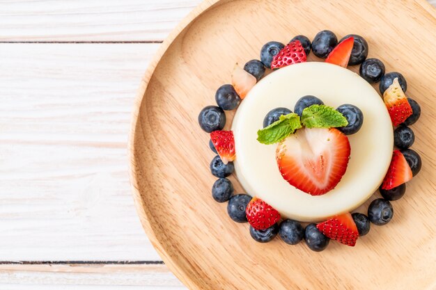 yogurt pudding with fresh strawberries and blueberries