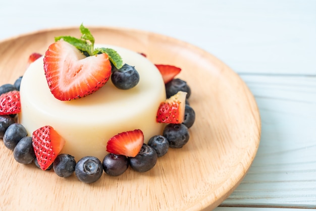 yogurt pudding with fresh strawberries and blueberries