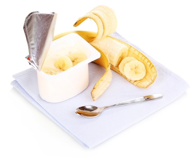 Yogurt with banana isolated on white