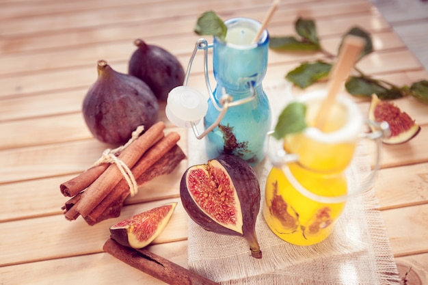 The yogurt with a fig in glass jars and cinnamon