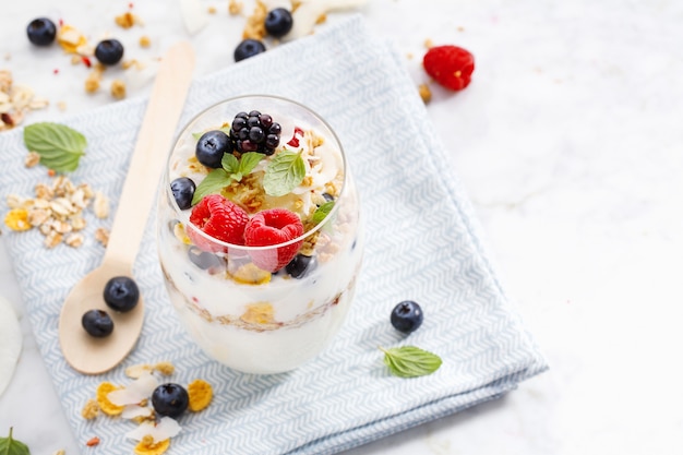 Yogurt with fresh berries served in glass