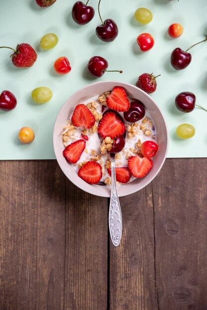 Yogurt with granola and fresh berries.