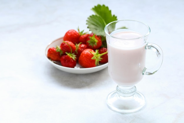 Yogurt with strawberries in a glass