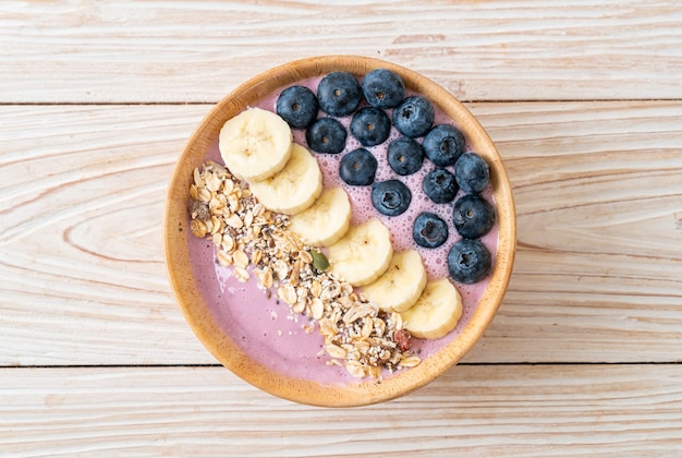 yogurt or yoghurt smoothie bowl with blue berry, banana and granola - Healthy food style