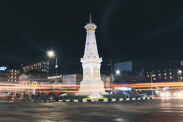 Yogyakarta Indonesia November 2019 Tugu Jogja or Yogyakarta Monument Indonesia Taken in night with vehicle traffic light trail