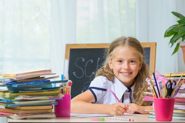 Yong school girl makes her homework