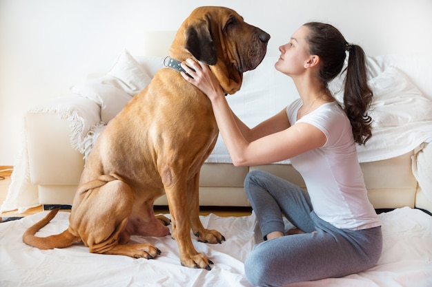 Yong Woman and her dog in home