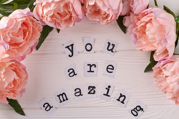 You are amazing inscription on white desk peony flowers frame