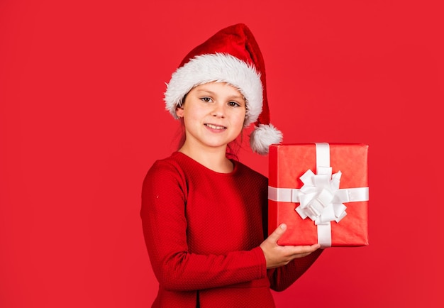 You are next kid santa hat hold gift box boxing day concept\
dreams come true happy new year winter holiday and xmas joy\
seasonal shopping discount little girl carry present big christmas\
sale