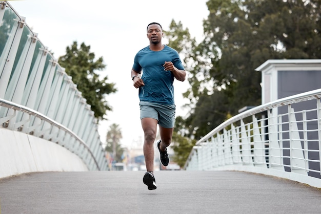 Do you dare be ordinary. Portrait of a sporty young man running outdoors.