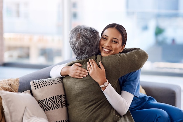 Photo you will always be appreciated for your kindness shot of a young nurse hugging a senior woman