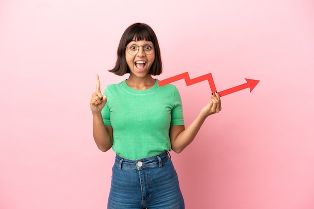 Youing woman holding a catching a rising arrow and pointing up