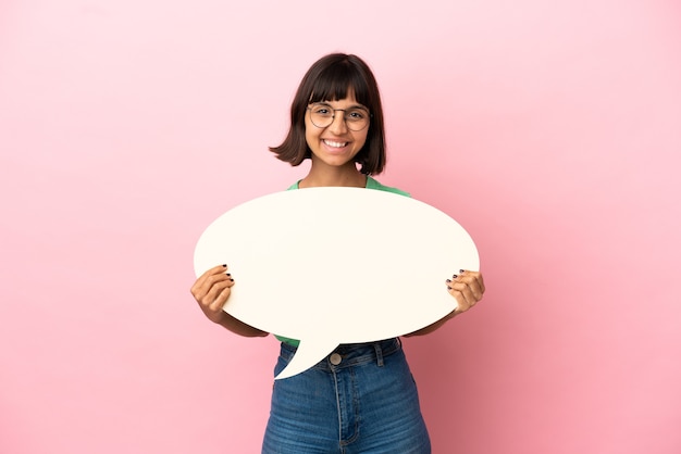 Youing woman holding an empty speech bubble