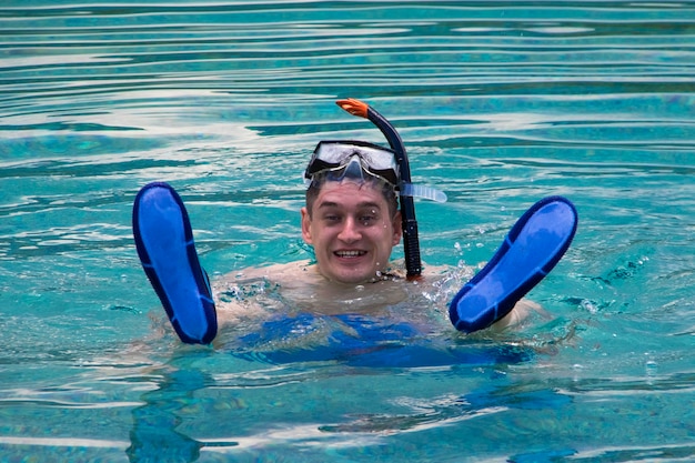 Youn man snorkeling in the sea