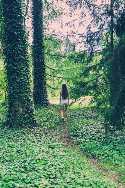 Yound woman in wild forest