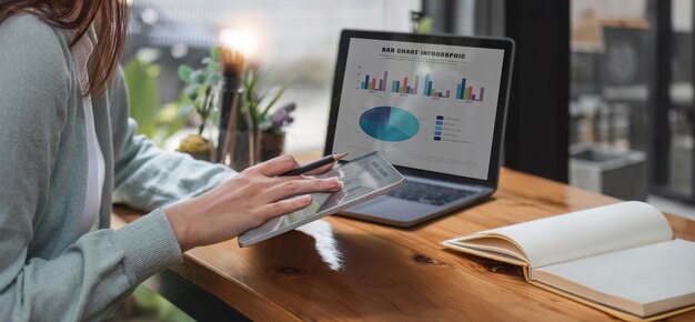 Photo young accountant calculates taxes expenses and finances with results in graph form for readability