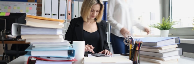 Young accountant working with papers in office