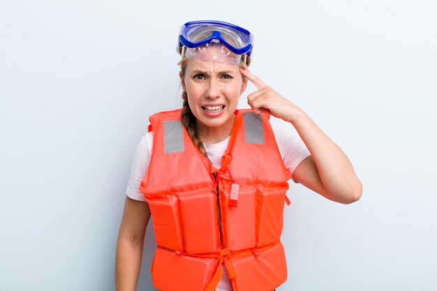 Young adult blonde woman life jacket and boat concept