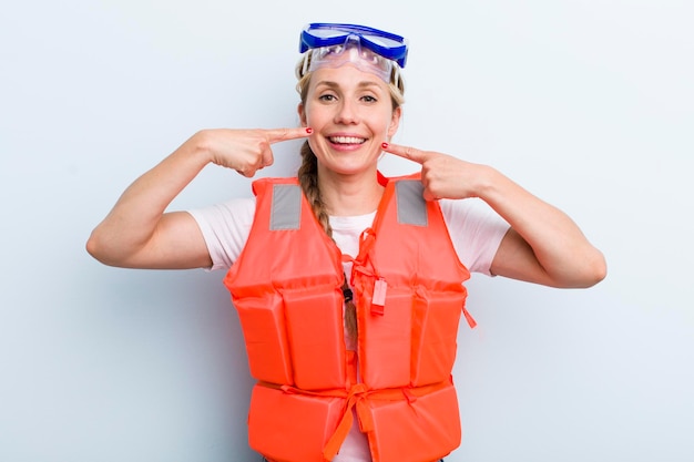 Young adult blonde woman life jacket concept