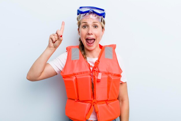 Young adult blonde woman life jacket concept