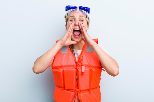 Young adult blonde woman life jacket concept