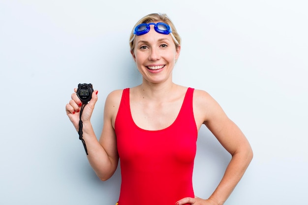 Young adult blonde woman swimmer and summer concept