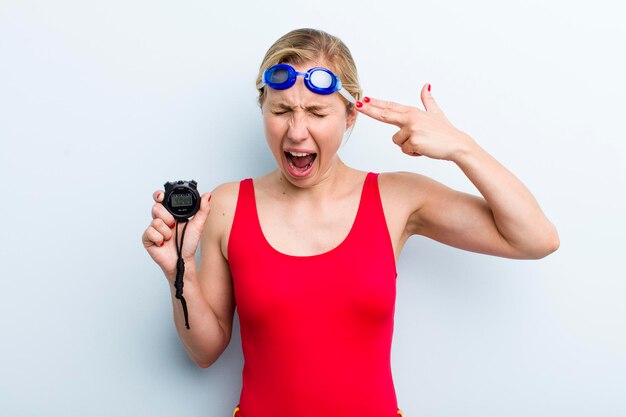 Young adult blonde woman swimmer and summer concept