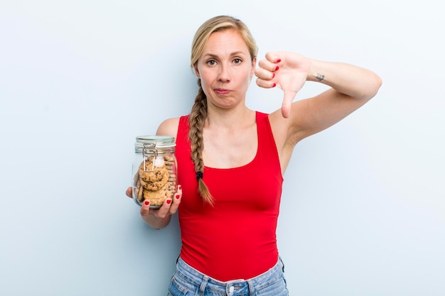 Young adult blonde woman with home made cookies