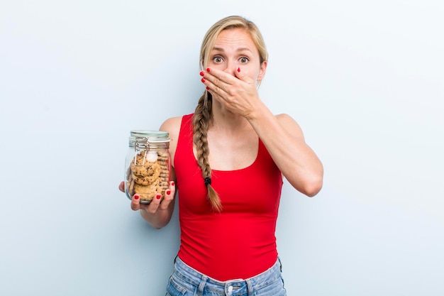 Young adult blonde woman with home made cookies