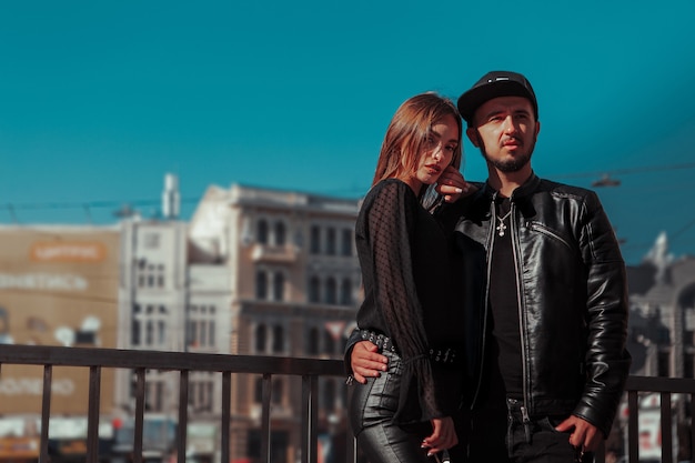 Young adult couple posing in the street