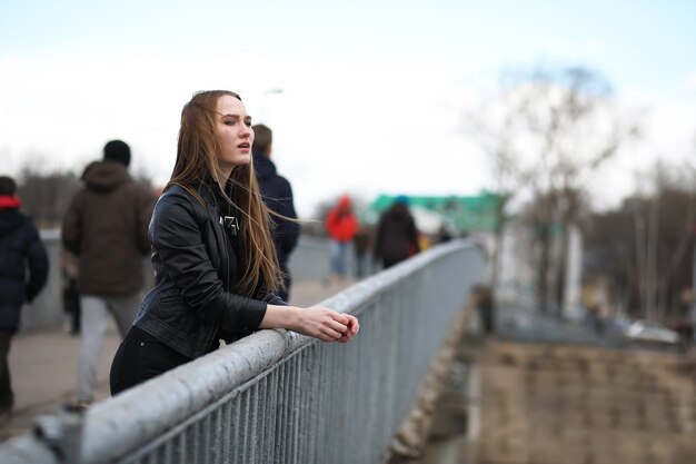 Young adult cute girl on a walk in the city