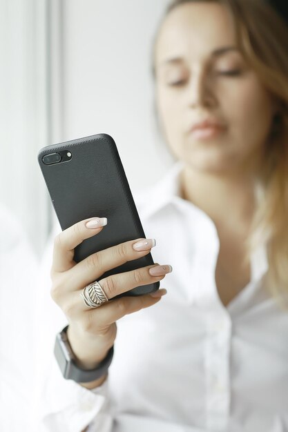 Young adult girl with phone