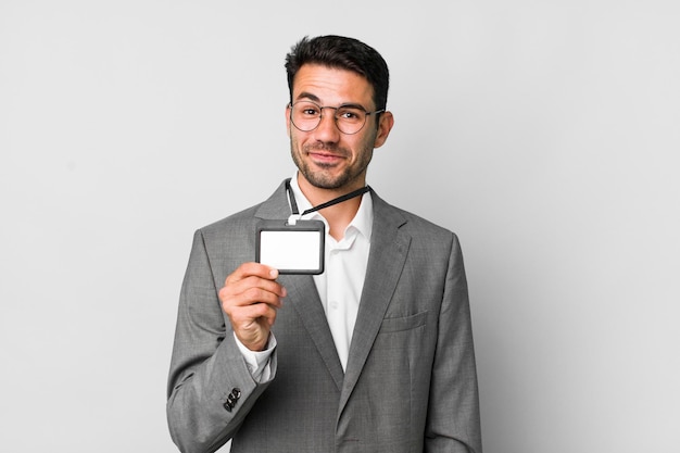 Young adult handsome hispanic man business and vip pass id concept