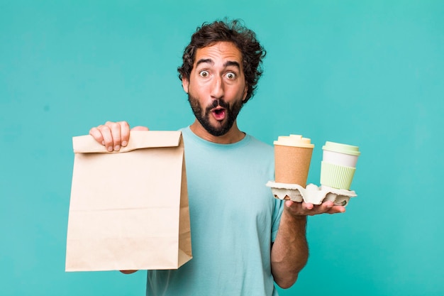 Young adult hispanic crazy man delivery take away coffees concept