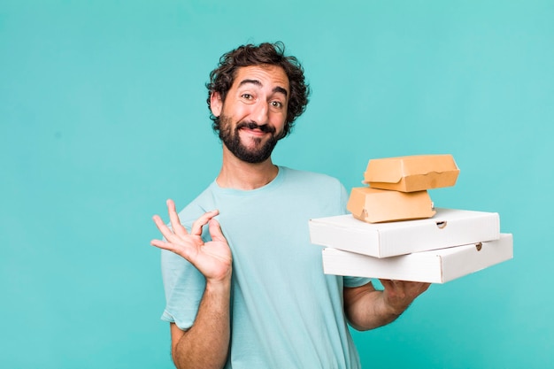 Young adult hispanic crazy man fast food delivery take away concept