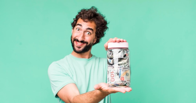 Photo young adult hispanic crazy man savings bottle concept