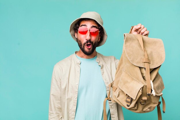 Young adult hispanic crazy man tourist or travel concept