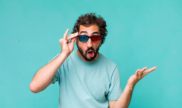 Young adult hispanic crazy man with 3d cinema glasses