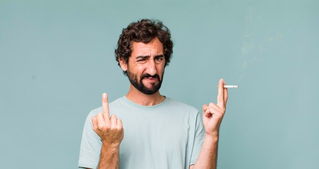 Young adult hispanic crazy man with a cigarette