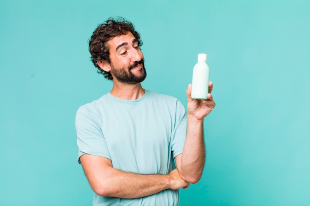 Young adult hispanic crazy man with a milk bottle