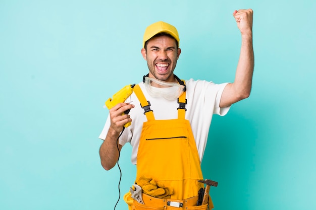 Young adult man handyman or repairman concept