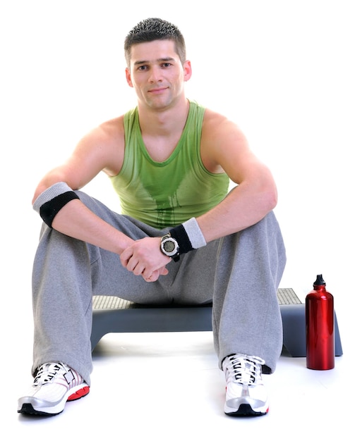 young adult man relax and drink water with sweat on body