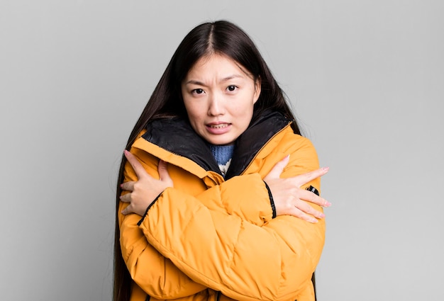 Young adult pretty asian woman wearing anorak winter and cold concept