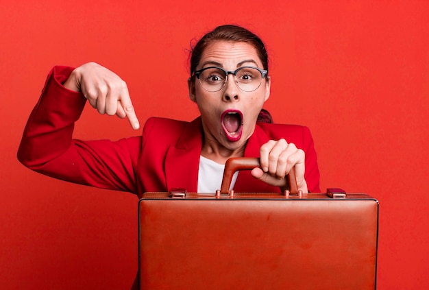 Young adult pretty businesswoman with a suitcase