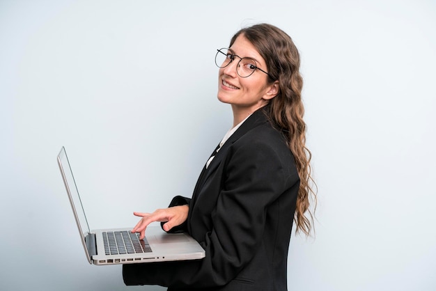 Young adult pretty woman holding a laptop