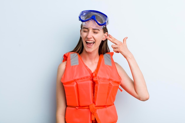 Young adult pretty woman life jacket and summer concept