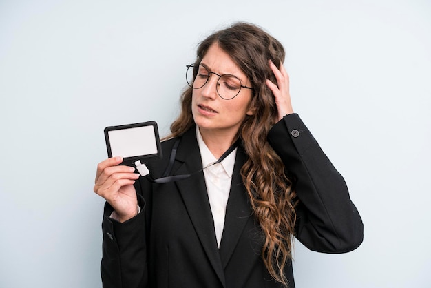 Young adult pretty woman showing a vip pass id