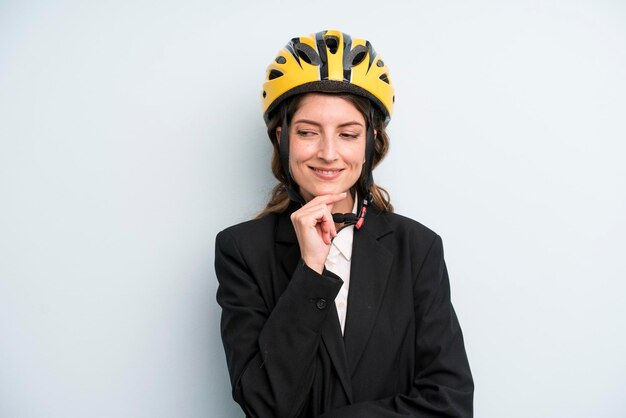 Young adult pretty woman with a bike helmet